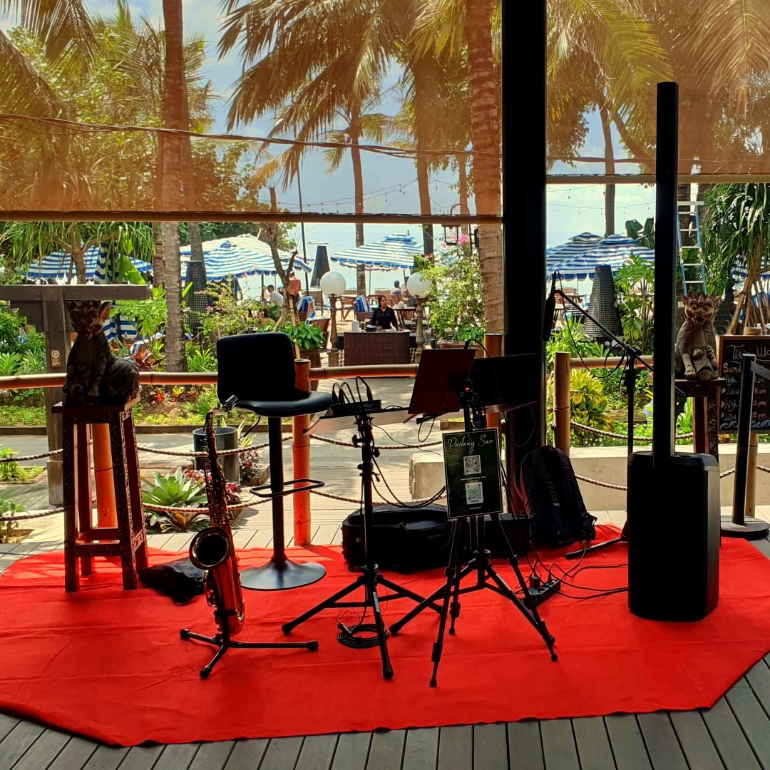 Professional saxophonist performing live for beach restaurant in Bali