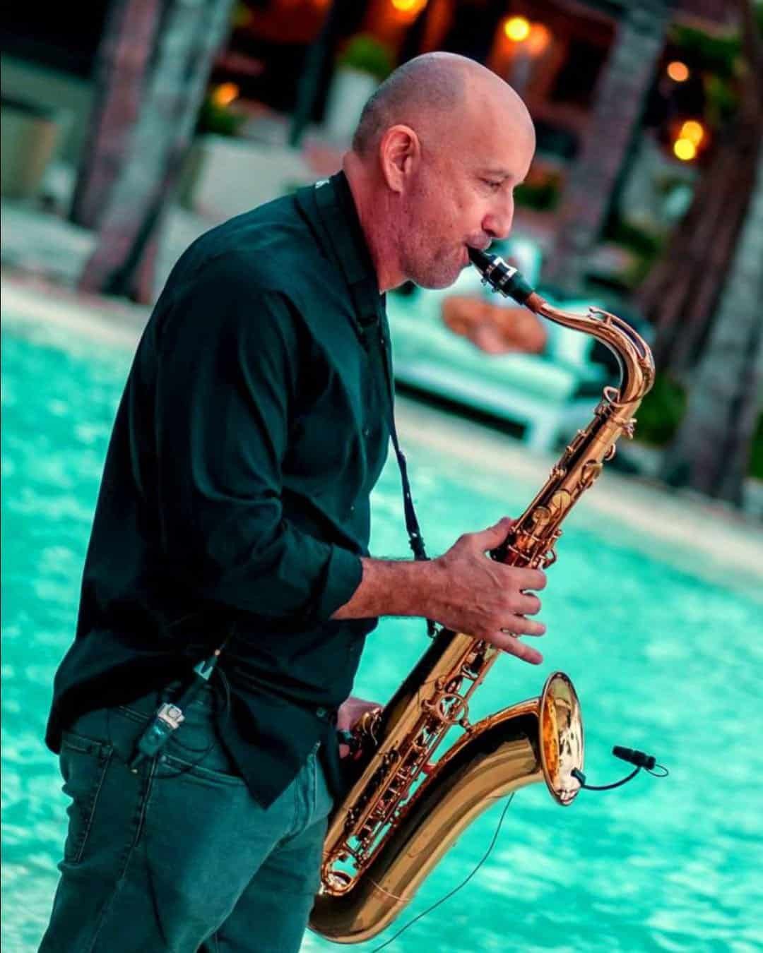 Beach lounge saxophone performance for a romantic poolside evening