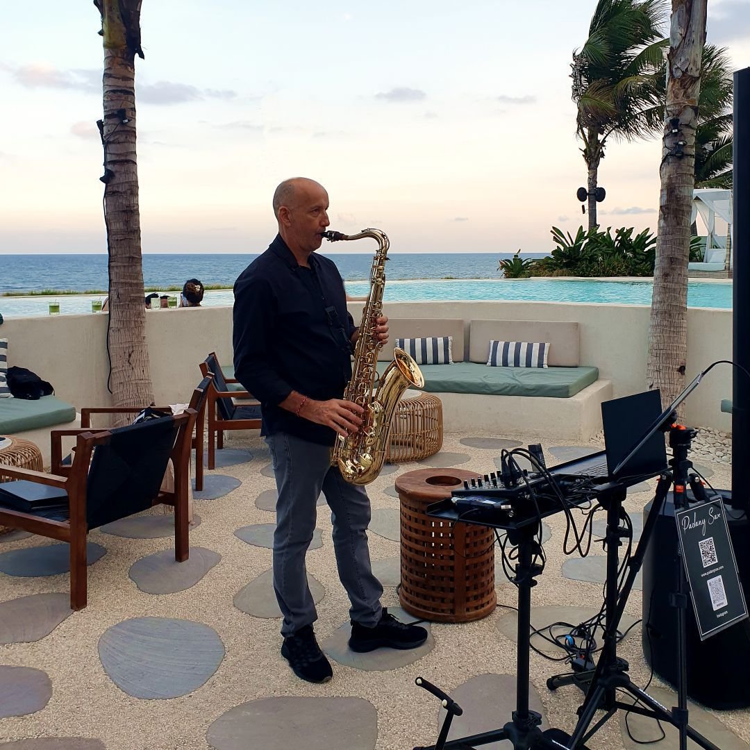 Saxophonist playing lounge jazz for an outdoor reception in Bali