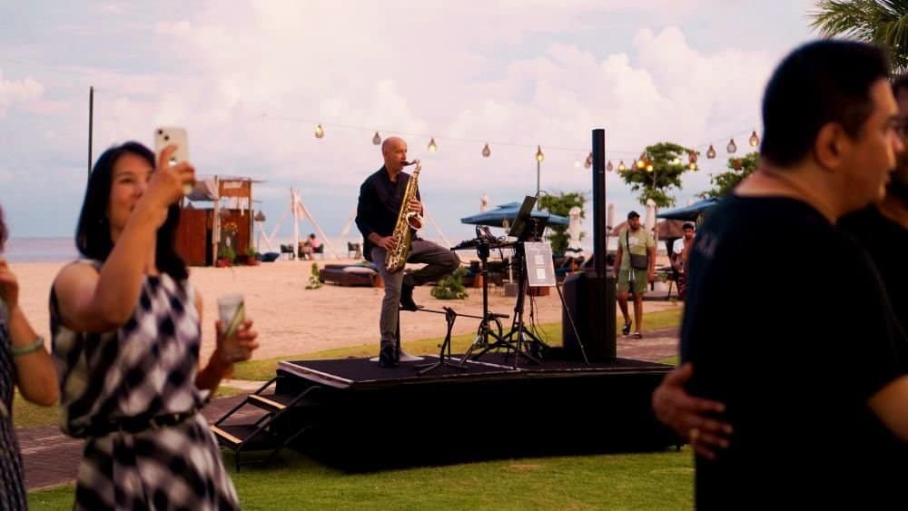 Saxophonist creating an elegant atmosphere for a private event at a resort
