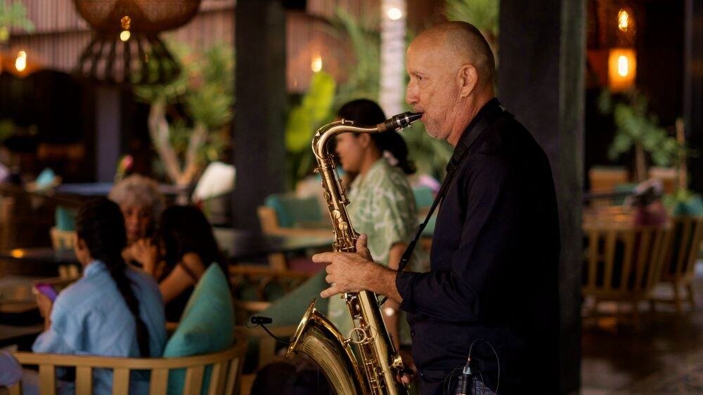 Romantic saxophone performance at a Bali beach restaurant