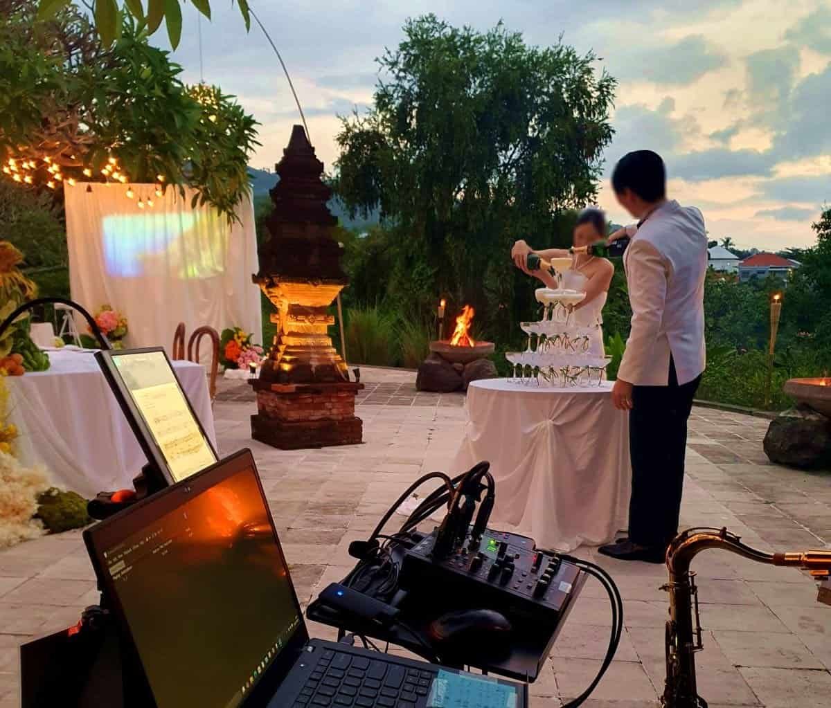 Luxury wedding entertainment with live saxophone performance at The Damai, Bali.